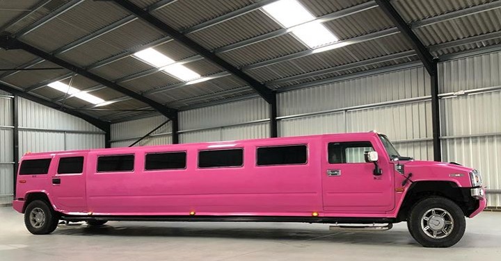 Chauffeur stretch pink Hummer H2 limousine hire in London, Essex, Kent, Surrey Hampshire, Berkshire, Hertfordshire, Buckinghamshire, Suffolk, Norfolk, Cambridgeshire, Bedfordshire and East of England.
