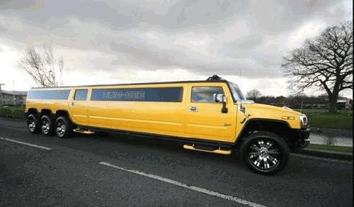Chauffeur stretched yellow 8-wheeler triple axle H2 hummer limo in London.