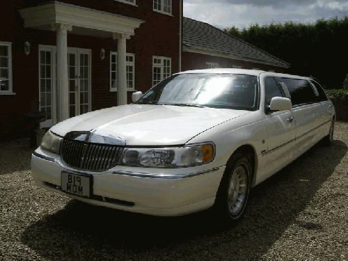Chauffeur driven stretch white Lincoln Millenium Town Car limo 8 seater with TV, DVD and Mirror bar in London, Essex, Kent, Surrey Hampshire, Berkshire, Hertfordshire, Buckinghamshire, Suffolk, Norfolk, Cambridgeshire, Bedfordshire and East of England.