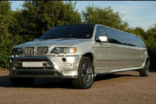 Chauffeur stretched silver BMW X5 limousine hire in London.