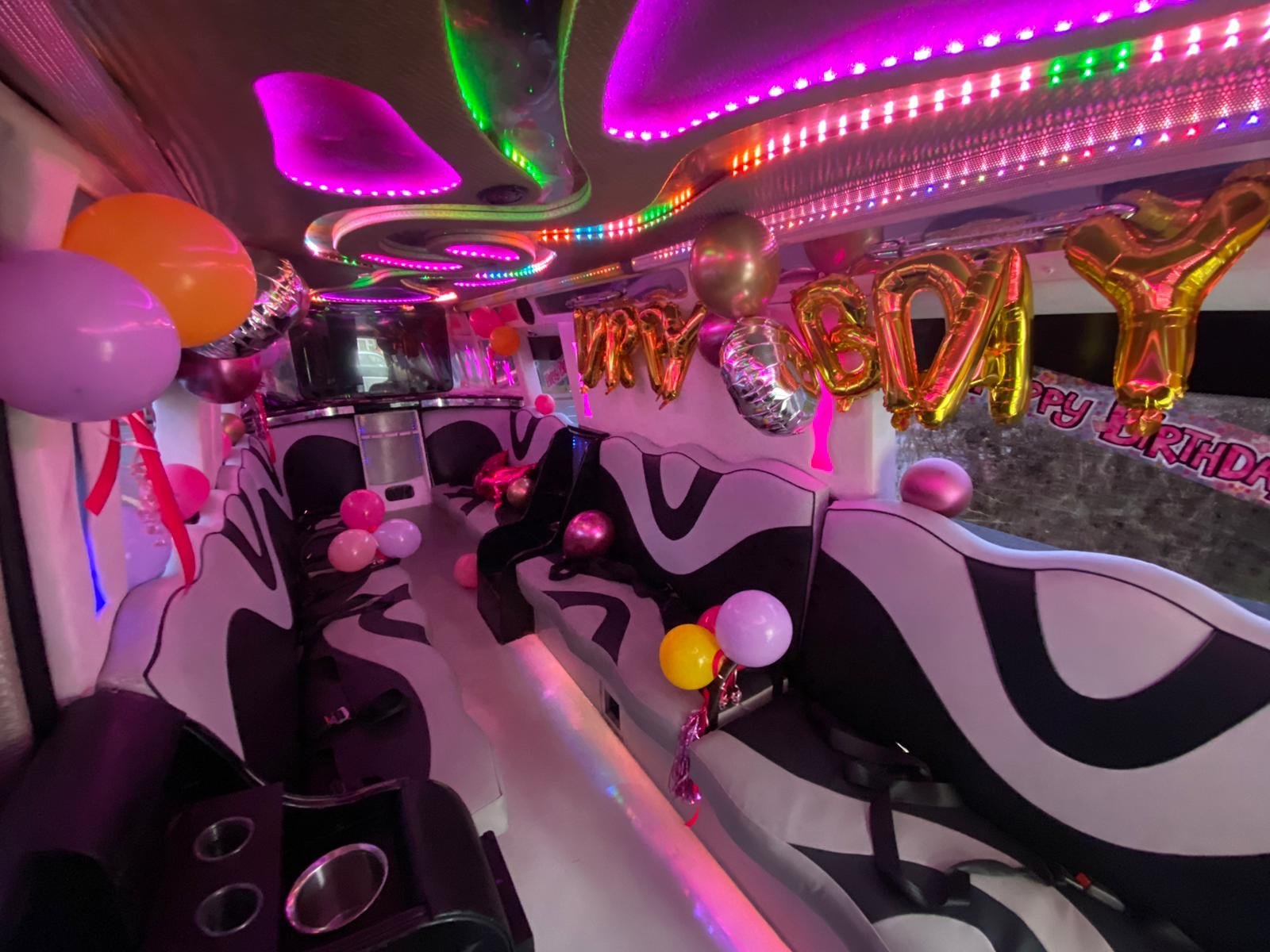 party bus decorated with balloons and led lights