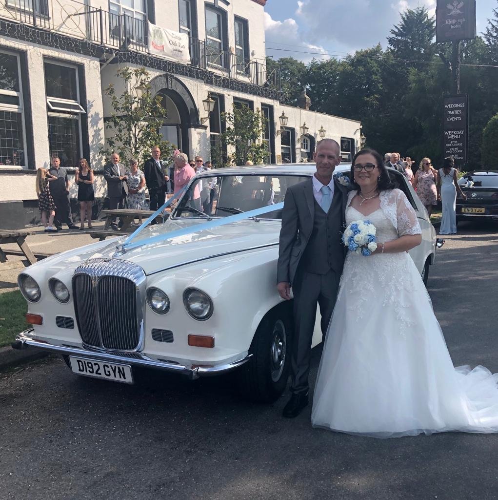 daimler wedding car with bride and groom
