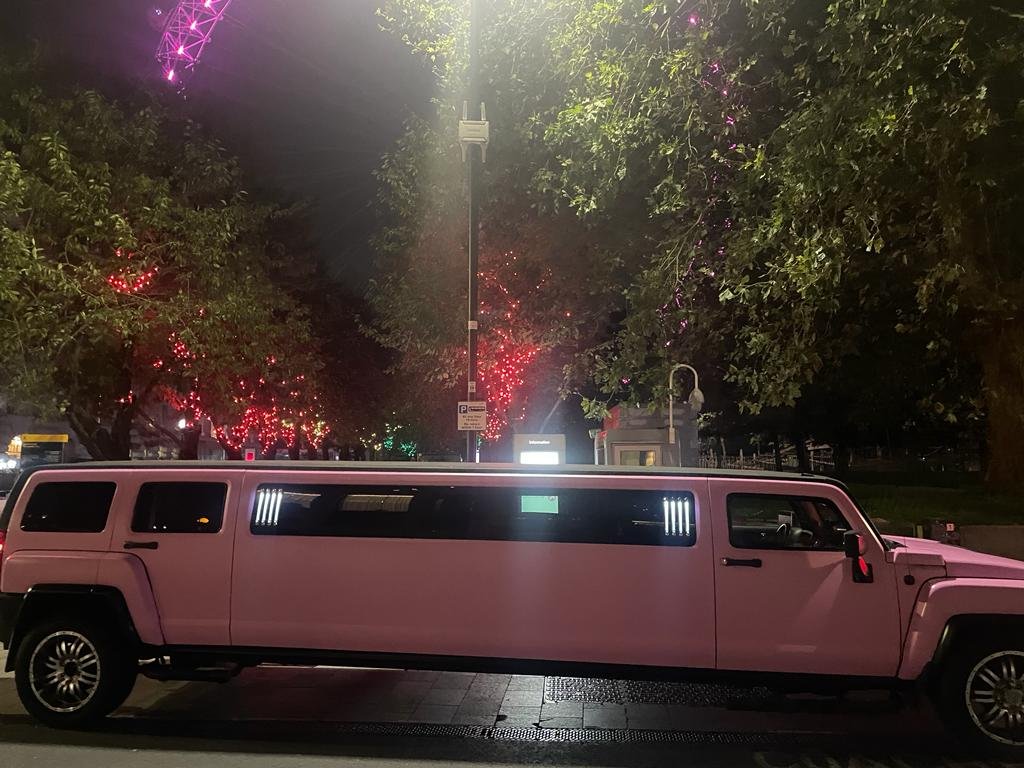 hummer limo in front of london eye touring london