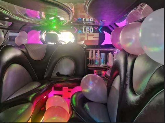 pink limo interior with balloons and party package