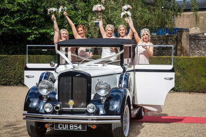 regent convertible wedding car with bridesmaids inside