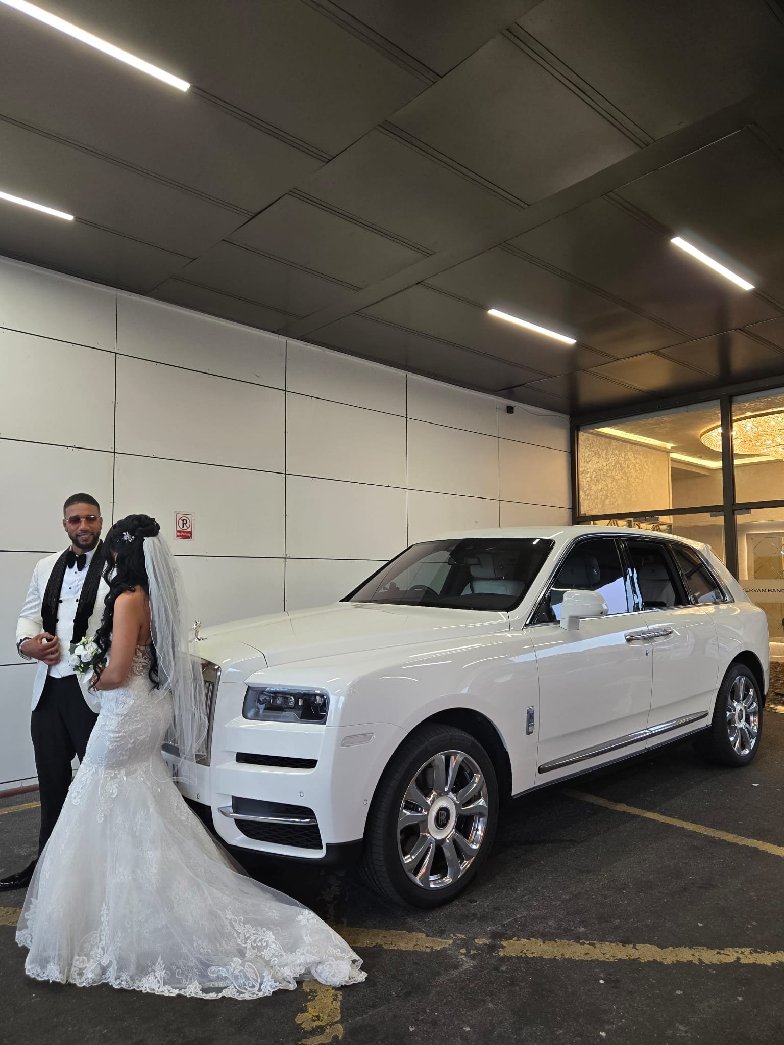 rolls royce cullinan with bride and groom