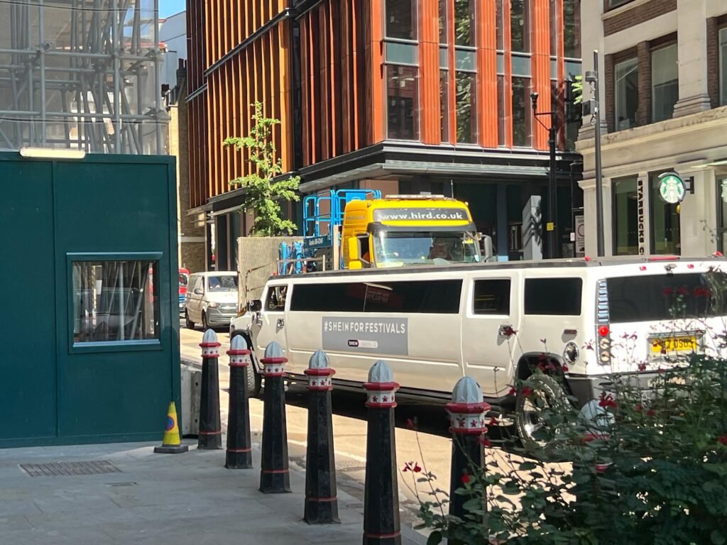 Temporary SHEIN graphics displayed on Hummer H2 event transport