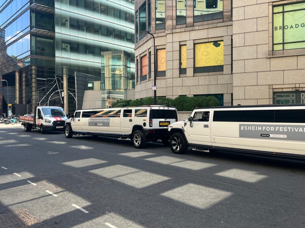 White Hummer H2 limousine with SHEIN temporary campaign branding