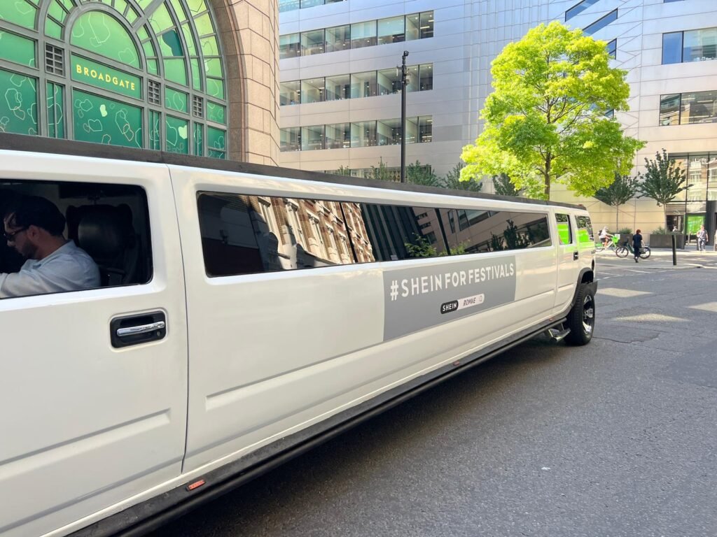 White Hummer H2 with SHEIN festival campaign graphics